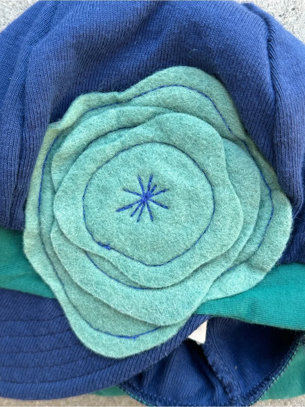 Cotton blend stretch cap baseball style hat navy green flower accent